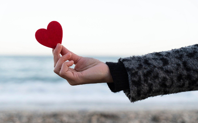 Five Easy Ways to Increase Feelings of Love a hand reaching out and presenting a heart